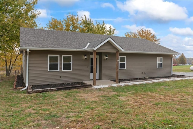 ranch-style home featuring a front yard