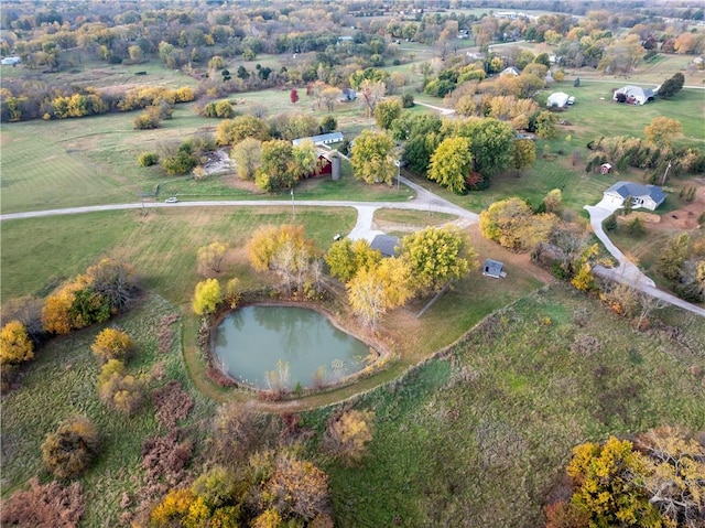 aerial view with a water view and a rural view