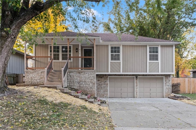 view of front of home with covered porch and a garage