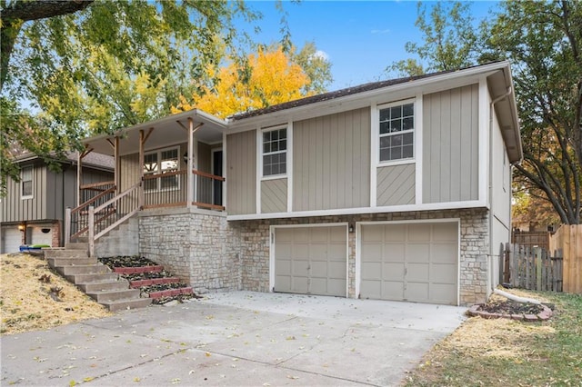 view of front of house featuring covered porch and a garage