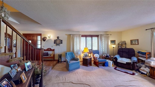 carpeted living room with a textured ceiling