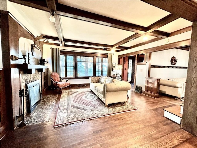 421 W Thompson St, Maryville, MO 64468 - living room featuring wood finished floors, coffered ceiling, beamed ceiling, and a fireplace