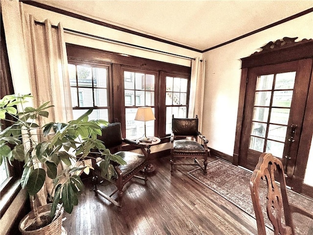 421 W Thompson St, Maryville, MO 64468 - sitting room featuring wood finished floors, crown molding, and baseboards