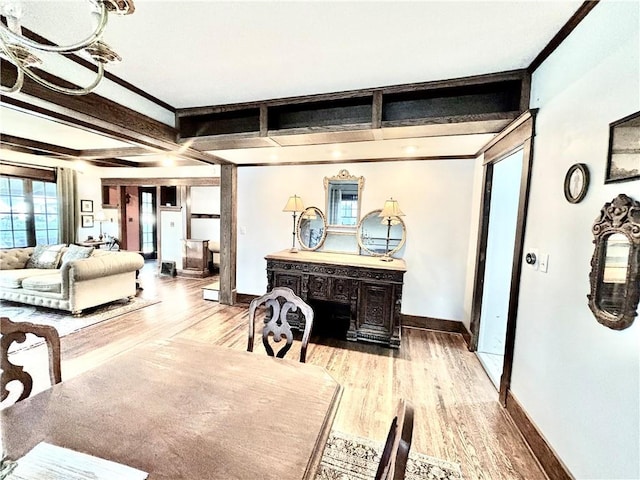 421 W Thompson St, Maryville, MO 64468 - living area with crown molding, light wood finished floors, and baseboards