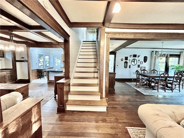 421 W Thompson St, Maryville, MO 64468 - stairway featuring beam ceiling, hardwood / wood-style flooring, coffered ceiling, and a notable chandelier