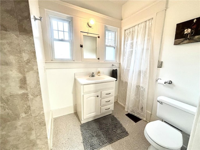 421 W Thompson St, Maryville, MO 64468 - full bathroom with toilet, baseboards, vanity, and a shower with shower curtain