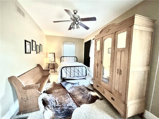 421 W Thompson St, Maryville, MO 64468 - bedroom with baseboards, visible vents, a ceiling fan, and carpet floors