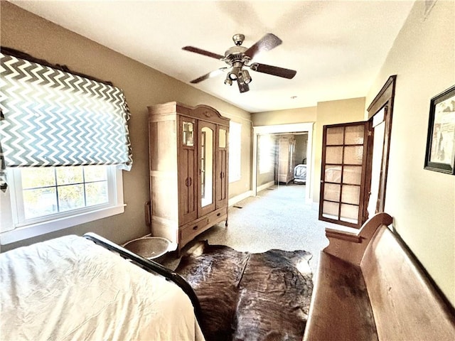 421 W Thompson St, Maryville, MO 64468 - bedroom featuring baseboards, ceiling fan, and carpet floors