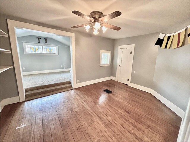 421 W Thompson St, Maryville, MO 64468 - spare room featuring wood-type flooring, a ceiling fan, visible vents, and a healthy amount of sunlight