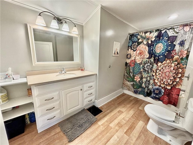 421 W Thompson St, Maryville, MO 64468 - full bath featuring a shower with curtain, ornamental molding, wood finished floors, and vanity
