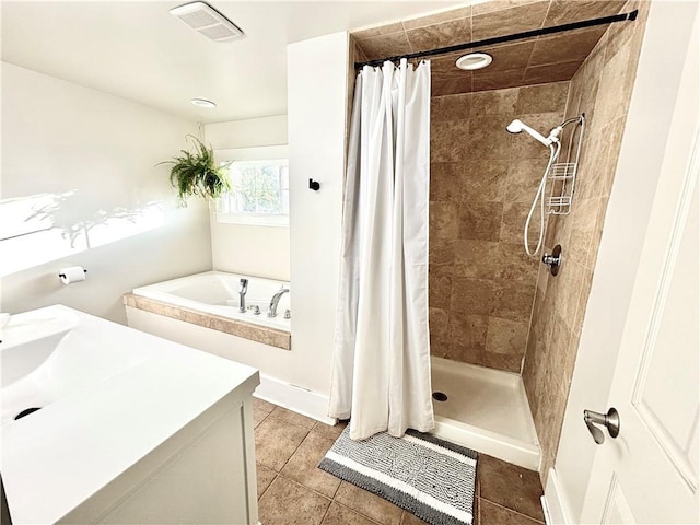 421 W Thompson St, Maryville, MO 64468 - bathroom featuring a garden tub, tile patterned flooring, visible vents, and a shower stall