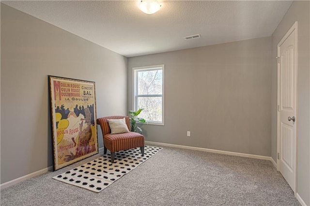 sitting room with carpet flooring