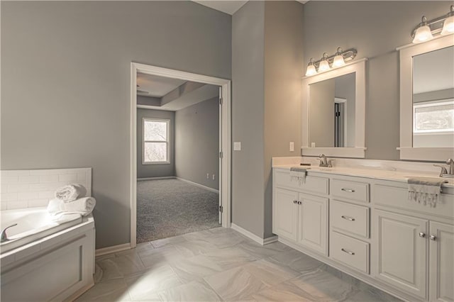 bathroom featuring vanity and a bathtub