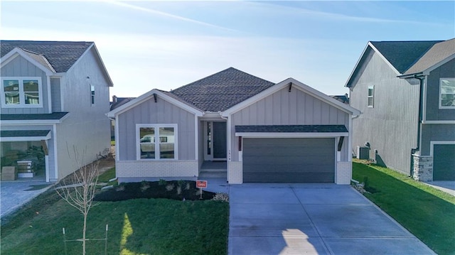 view of front of home with central air condition unit and a front lawn