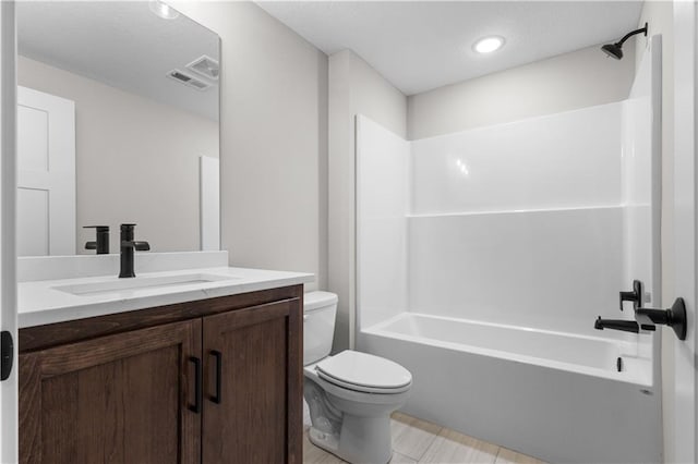 full bathroom with bathtub / shower combination, vanity, and toilet