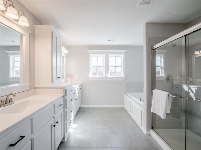 bathroom featuring a sink, visible vents, two vanities, and a shower stall