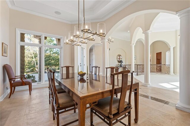 21111 W 95th Ter, Lenexa, KS 66220 - dining area featuring ornamental molding, arched walkways, light tile patterned floors, and a high ceiling