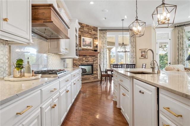 21111 W 95th Ter, Lenexa, KS 66220 - kitchen featuring a chandelier, tasteful backsplash, custom range hood, and a sink
