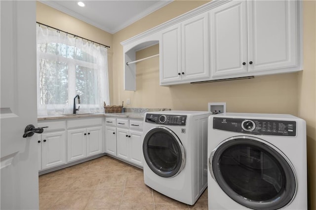 21111 W 95th Ter, Lenexa, KS 66220 - clothes washing area featuring separate washer and dryer, cabinet space, ornamental molding, a sink, and light tile patterned flooring