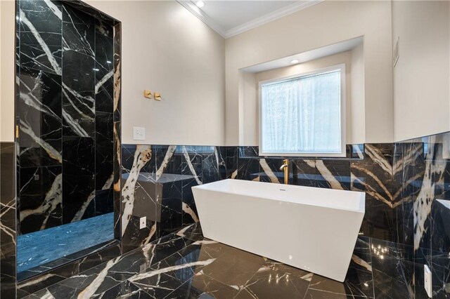 21111 W 95th Ter, Lenexa, KS 66220 - full bath with a soaking tub, crown molding, tile walls, marble finish floor, and wainscoting
