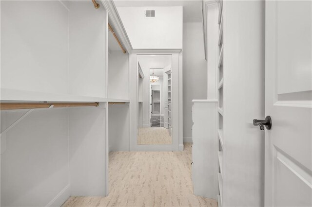 21111 W 95th Ter, Lenexa, KS 66220 - walk in closet featuring wood finished floors and visible vents