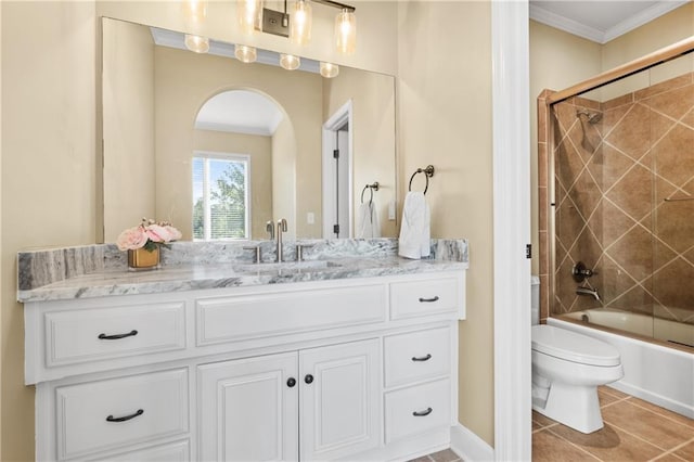 21111 W 95th Ter, Lenexa, KS 66220 - full bathroom featuring tile patterned flooring, shower / bath combination with glass door, ornamental molding, toilet, and vanity