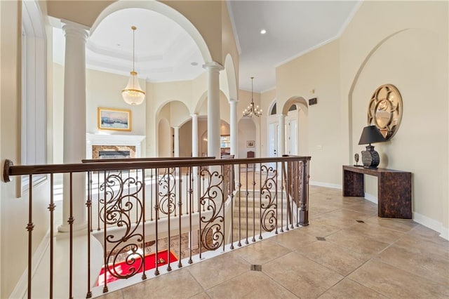 21111 W 95th Ter, Lenexa, KS 66220 - hallway featuring baseboards, ornamental molding, and decorative columns