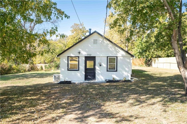 rear view of house with a lawn