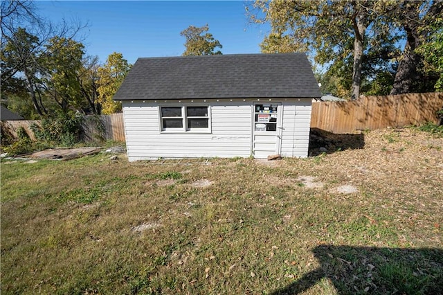 view of outdoor structure featuring a yard