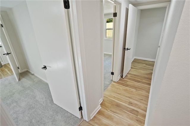 hallway featuring light hardwood / wood-style flooring