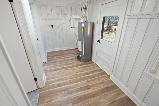 utility room featuring gas water heater