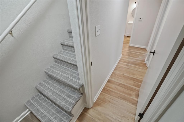 staircase featuring hardwood / wood-style flooring