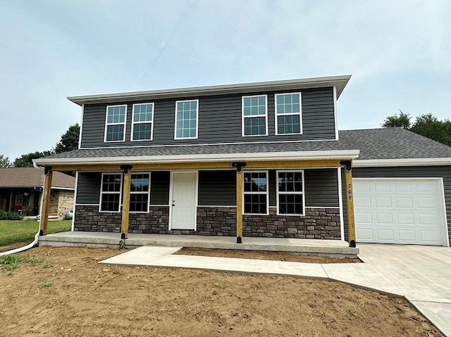 view of front of house with covered porch and a garage