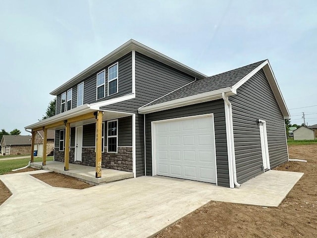 view of front of house with a garage and a porch