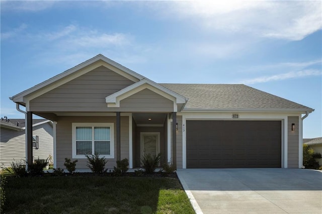 view of front of home featuring a garage and a front lawn