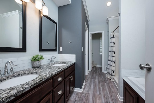 bathroom with hardwood / wood-style floors, tasteful backsplash, separate shower and tub, vanity, and crown molding