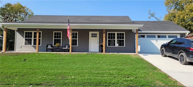 ranch-style house featuring a front lawn, a porch, and a garage