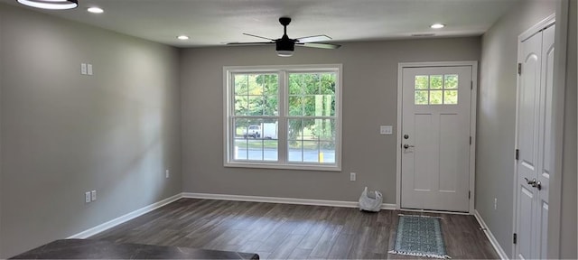 entrance foyer featuring ceiling fan, plenty of natural light, and dark hardwood / wood-style floors