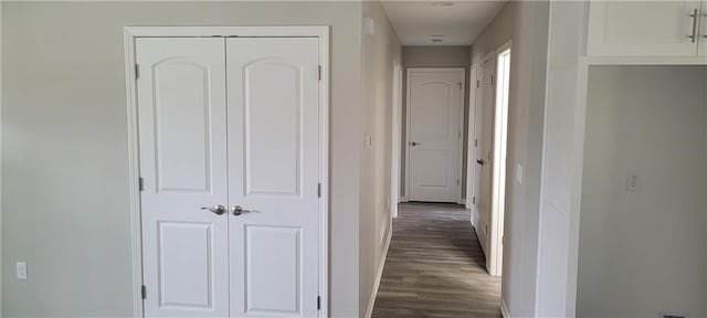 corridor featuring dark hardwood / wood-style floors