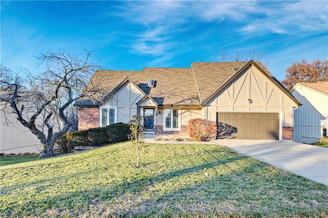 tudor-style house with a garage and a front yard