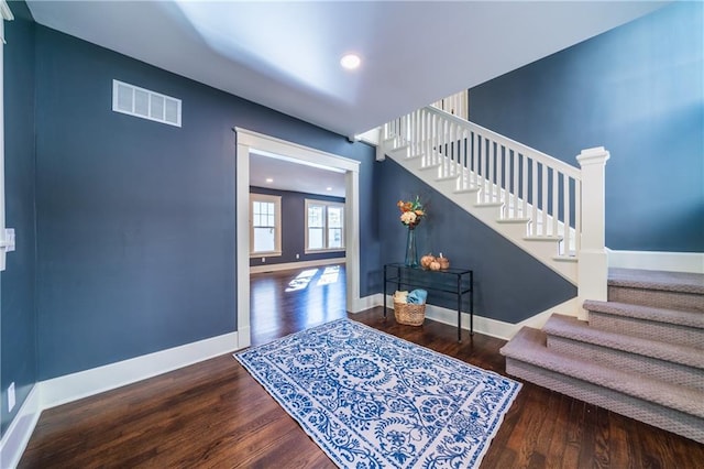 foyer entrance featuring wood-type flooring