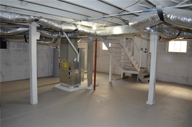 basement featuring heating unit and gas water heater