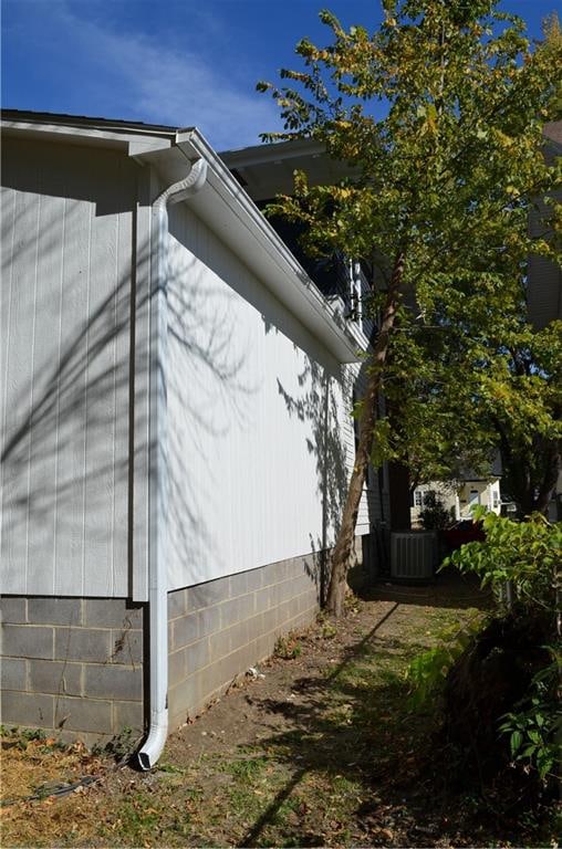 view of side of property with central AC unit