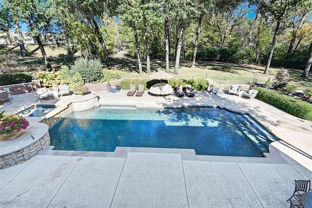 view of swimming pool featuring an in ground hot tub and a patio area