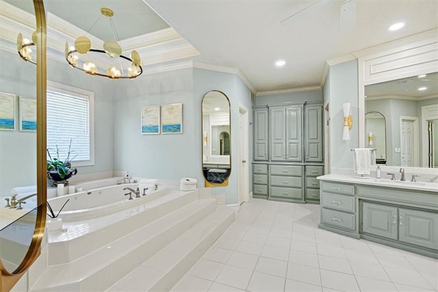 bathroom featuring vanity, a tub to relax in, crown molding, and tile patterned flooring