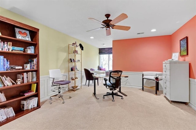 carpeted home office with ceiling fan