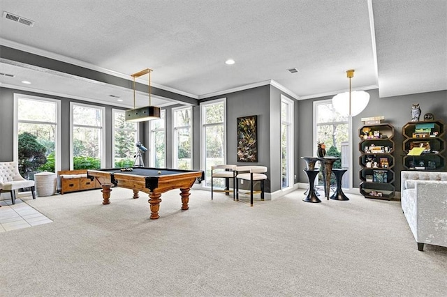 rec room featuring a textured ceiling and carpet