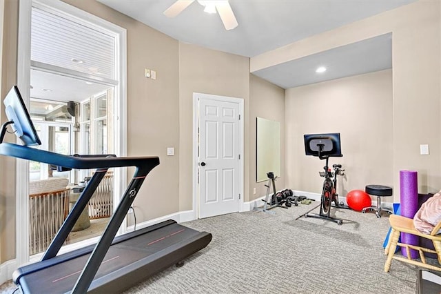 exercise room with carpet and ceiling fan