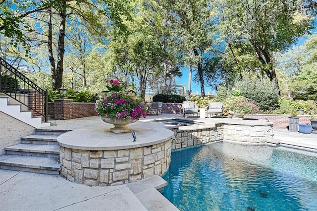 view of pool featuring a patio