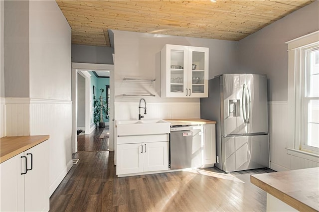 kitchen featuring white cabinets, appliances with stainless steel finishes, wooden ceiling, and sink